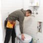 plumber repairing a toilet 85x85